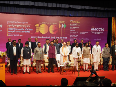 The dais members standing at attention for the national anthem